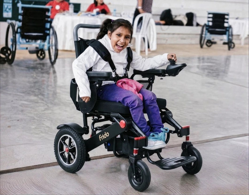 Girl in a Frido powered wheelchair